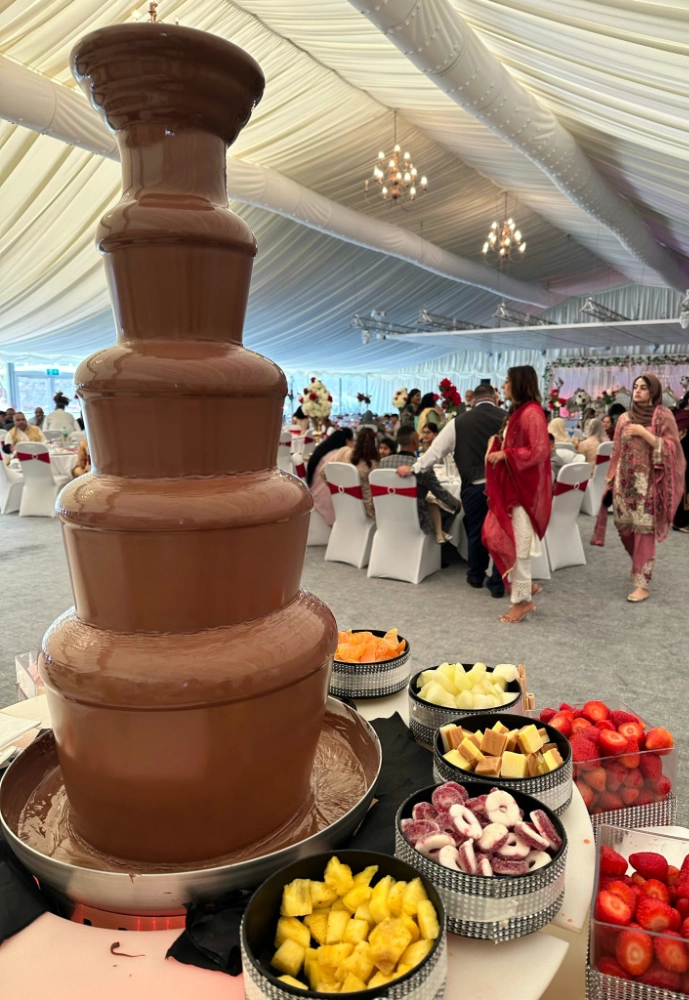 A very tall chocolate fountain