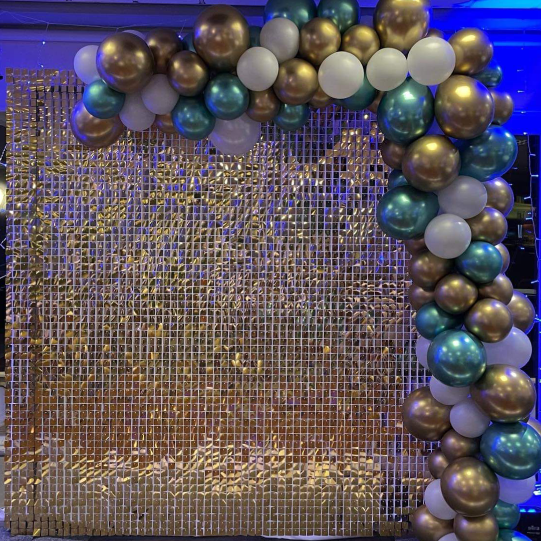 Stylish gold glitter wall with balloons